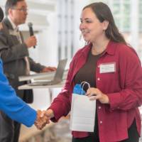 Carmen Fernandez Florez receiving her bag